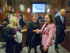 Vancouver city councillors (left to right) Melissa De Genova, Rebecca Bligh and Lisa Dominato chat after having their first meeting at City Hall in Vancouver, B.C., NOV. 5, 2018.