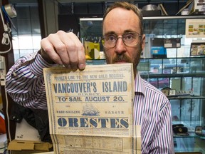 Brian Grant Duff holds up a unique 'broadsheet' from 1858 advertising a ship travelling from Australia to the 'new gold region' on 'Vancouver's Island.'