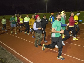 Members of the Surrey-based Punjab Running Club take off — with plenty of smiles — during a training session this week.