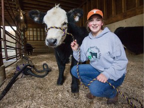 Layla Dorko, with her calf Izzy, calls the fundraiser 'a way to say thank you.'