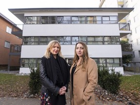 Lorna Allen (left) and Sarah Mayer pose of a photo in front of their West End apartment building that they are facing eviction from despite winning a dispute against their landlord last month with the provincial Residential Tenancy Branch.