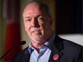 B.C. Premier John Horgan addresses the crowd during an electoral reform referendum rally in Vancouver on Sunday, Nov. 18, 2018.