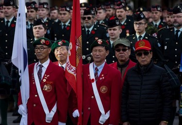 South Korean veterans stand with members of the Canadian Forces during a Remembrance Day ceremony in Vancouver, on Sunday, November 11, 2018.