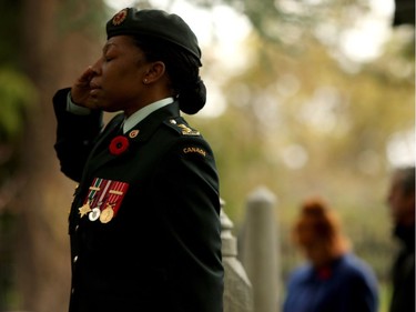 Lieutenant Kerry-Ann Cameron salutes during Remembrance Day ceremonies at God's Acre Veteran's Cemetery in Victoria on Sunday, November 11, 2018.