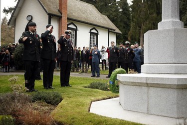 Royal Canadian Navy personnel salute during a Remembrance Day ceremony at God's Acre Veteran's Cemetery in Victoria on Sunday, November 11, 2018.