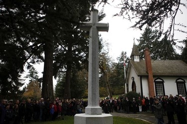 People gather during a Remembrance Day ceremony at God's Acre Veteran's Cemetery in Victoria on Sunday, November 11, 2018.