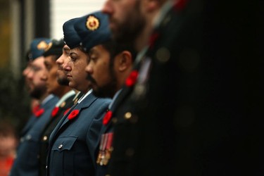Military personnel during a moment of silence at Remembrance Day ceremonies at God's Acre Veteran's Cemetery in Victoria on Sunday, November 11, 2018.