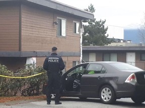 A 23-year-old Surrey man has been charged in the death of Elizabeth Poulin. The woman was found dead her in apartment near Kingsway and Kerr on Nov. 24, pictured here in this file photo.