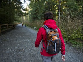 Walkers out in Lynn Headwaters Regional Park on the North Shore, which is now closed after heavy rains on the weekend.