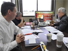 Neil McEvoy, the late Bobby Ackles and Wally Buono (left to right) in the Lions’ ‘war room’ in April 2008 for that year’s CFL draft of Canadian amateur players.