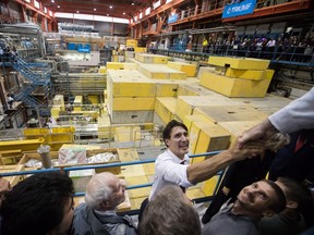 Prime Minister Justin Trudeau greets staff and students during a visit to TRIUMF, Canada's national particle accelerator owned and operated as a joint venture by a consortium of universities, at the University of British Columbia in Vancouver on Thursday November 1, 2018.