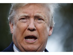 In this Nov. 9, 2018, photo, President Donald Trump talks with reporters before departing for France on the South Lawn of the White House in Washington.