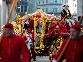The Lord Mayor of the City of London, Alderman Peter Estlin, waves from his carriage during the Lord Mayor's Show last month in London.