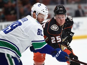 Sam Gagner of the Vancouver Canucks battles Ondrej Kase of the Anaheim Ducks for position during the first period of a game at Honda Center on Nov. 21, 2018 in Anaheim, California.