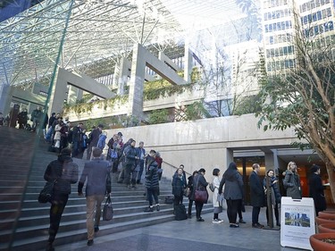 People wait in line to attend the bail hearing of Huawei Technologies Chief Financial Officer Meng Wanzhou in Vancouver on Dec. 7, 2018 in Vancouver.