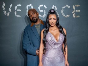 Kanye West and Kim Kardashian West attend the the Versace fall 2019 fashion show at the American Stock Exchange Building in lower Manhattan on December 02, 2018 in New York City.