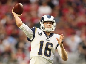 Quarterback Jared Goff #16 of the Los Angeles Rams drops back to pass during the NFL game against the Arizona Cardinals at State Farm Stadium on December 23, 2018 in Glendale, Arizona. The Rams defeated the Cardinals 31-9.