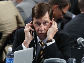 Nashville Predators general manager David Poile in his usual spot at an NHL Entry Draft, working the phones.