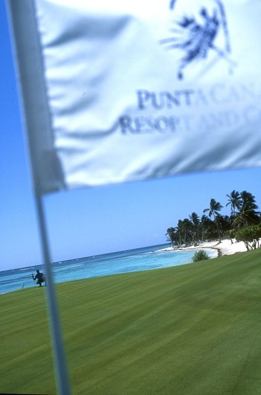 A golfer lines up a putt on the gorgeous 18th green, Punta Cana Golf Course.