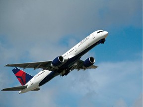 (FILES) This file photo taken on February 21, 2013 shows a Delta Airlines jet taking off.  Passengers aboard a Delta Air Lines flight had to make an emergency landing on a remote Alaskan island due to a potential engine issue.