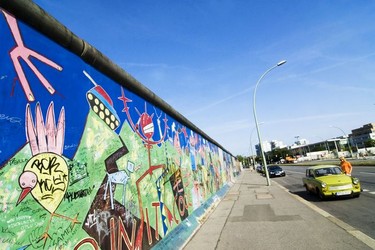 The East Side Gallery is the longest piece of the Berlin wall remaining and hundreds of artists have revamped the once dull concrete to create the world's largest open-air gallery featuring hundreds of airbrushed murals.