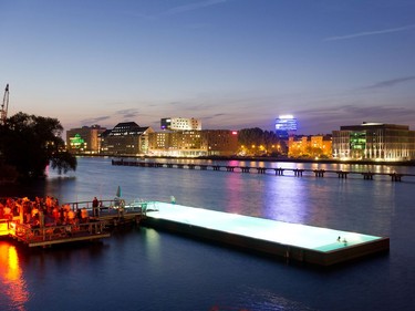 The Badeschiff and Spree River at night.