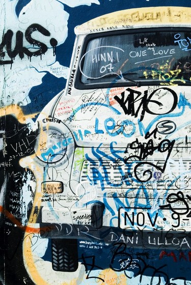 Mural of a Trabi breaking through the Berlin wall- East Side Gallery.