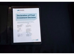 A copy of a signed declaration of final investment is seen after it was signed by LNG Canada joint venture participants during a news conference in Vancouver on Tuesday, Oct. 2, 2018. The National Energy Board is scheduling hearings over the next three months to consider a jurisdictional challenge of the approval of a pipeline needed to supply natural gas for the recently sanctioned $40-billion LNG Canada project.