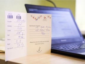 In this photo taken on Friday, Nov. 16 2018 in Tallinn, Estonia, a card shows all the details to register the birth of new baby Oskar Lunde. The Baltic nation of 1.3 million people are engaged in an ambitious project to make government administration completely digital to reduce bureaucracy, increase transparency and boost economic growth.