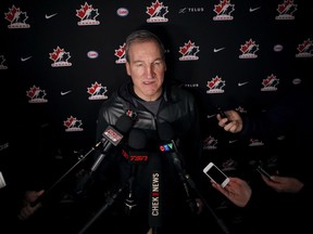 Team Canada head coach Tim Hunter speaks to reporters about his world junior tournament entry in Victoria earlier this month.