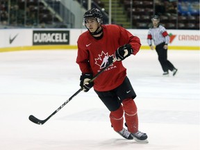 Team Canada's Brett Leason looks for an open man during Wednesday’s game against U Sports at the Q Centre in Colwood.