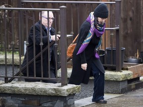 Huawei chief financial officer Meng Wanzhou, leaves her home with a security guard in Vancouver on Wednesday, December 12, 2018.