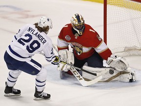 Florida Panthers goaltender Roberto Luongo, right, defends the goal against Toronto Maple Leafs right wing William Nylander Saturday, Dec. 15, 2018, in Sunrise, Fla. (AP Photo/Brynn Anderson)