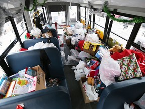 Santa's school bus is full of donated toys and other gifts.