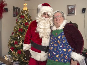 Ted Carroll, a Santa-for-hire, and his wife Kim, as Mrs. Claus, display their outfits in Halifax on Dec. 17, 2018. Professional Santas and their associates across the country are into the busy season as Christmas draws closer.