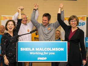 NDP MLAs Selina Robinson (left to right), Scott Fraser and Rob Fleming celebrate Sheila Malcolmson's nomination as the NDP candidate in the upcoming byelection for the riding of Nanaimo.