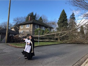 The Reverend Lindsay Hills, rector of St. Mary's in Kerrisdale had just returned from a graveside service when she saw the church's neighbouring property had lost a large tree during Thursday's windstorm. Still in her robes, she directed traffic for 30 minutes.