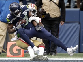 Seattle Seahawks wide receiver Jaron Brown (18) catches a pass for a touchdown during the first half of an NFL football game against the San Francisco 49ers, Sunday, Dec. 2, 2018, in Seattle.