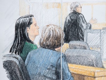 In this courtroom sketch, Meng Wanzhou, left, the chief financial officer of Huawei Technologies, sits beside a translator during a bail hearing at B.C. Supreme Court in Vancouver, on Friday December 7, 2018. She was arrested Saturday after an extradition request from the United States while in transit at the city's airport.