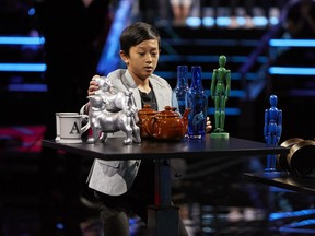 Matthew Yu is seen here competing in the Snap Shelf Challenge during the Canada's Smartest Person Junior TV show on CBC. Photo: Courtesy of CBC