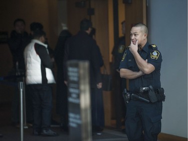 Huawei executive Meng Wanzhou appeared in BC Supreme Court in Vancouver, Dec. 7, 2018 for a bail hearing. Pictured is a sheriff keeping an eye on people who came to watch the proceedings.