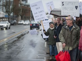 About 150 people protested on Saturday morning TransLink's plans to add a B-Line bus route to Marine Drive, beginning in the Dundarave neighbourhood of West Vancouver.