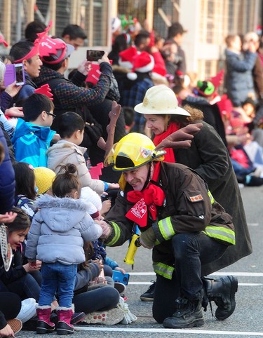 First responders wow some young fans during Vancouver's Christmas Parade, in Vancouver, BC., December 2, 2018.