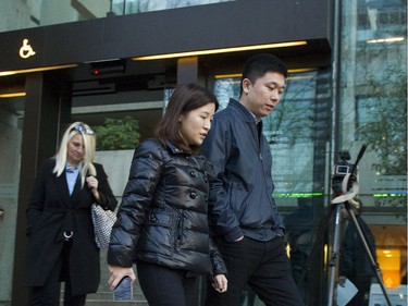 People leave the B.C. Supreme Court  on December 07 2018 after the bail hearing for Huawei's Meng Wanzhou was adjourned to Monday.