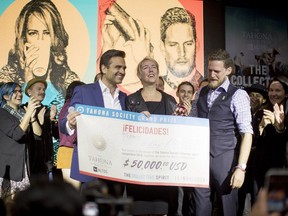 JALISCO, MEXICO — Tahona Society panel member Christophe Prat (left) presents Makenzie Chilton (middle) and Alex Black (right) with a $50,000 USD winners cheque in November 2018, after the Vancouver-based pair were named winners of the Tahona Society Collective Spirit competition. The pair won for their concept Mind the Bar which aims to improve bartender welfare by tackling mental health issues like anxiety, depression, addiction and workplace harassment.