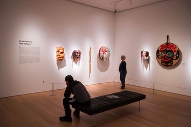 A man and woman view works in the Contemporary First Nations Gallery at the Audain Art Museum in Whistler.