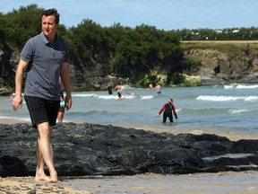 David Cameron walks on the beach at Mother Iveys Bay next to Harlyn Bay on July 27, 2008 in Harlyn, near Padstow, England.