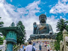 :Located at Po Lin Monastery on Lantau Island, the Tian Tan Buddha is the world’s second largest outdoor bronze Buddha statue.
