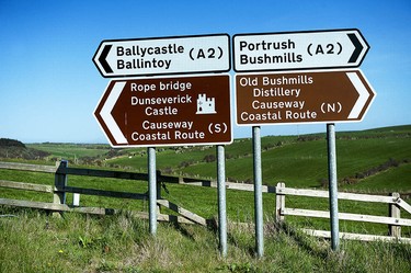 A road sign points to some of the attractions along the Causeway Coast. Photo credit: Paul Marshall