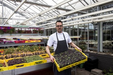 Chef, Bas Wiegel inside the greenhouse at restaurant De Kas.